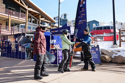 Couple Picking Up Rental Gear at My Epic Gear Slopeside Tent