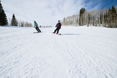 Couple Skiing and Riding at Park City