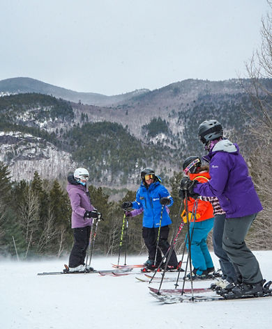 Instructor Talking to Women at Attitash Women's Weekend 2025 Event