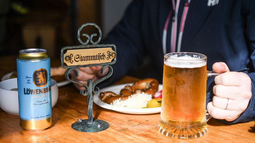 Guests Dining at Stammtisch/Reserved Table with Food and Bear at Horstman Hut at Blackcomb Mountain