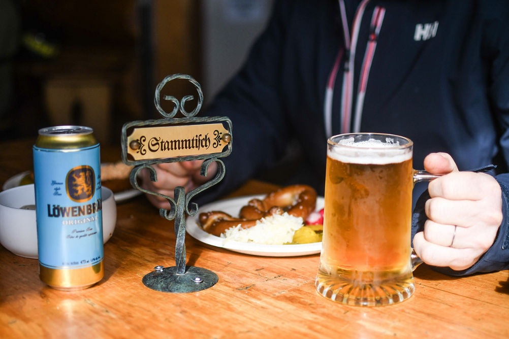 Guests Dining at Stammtisch/Reserved Table with Food and Bear at Horstman Hut at Blackcomb Mountain