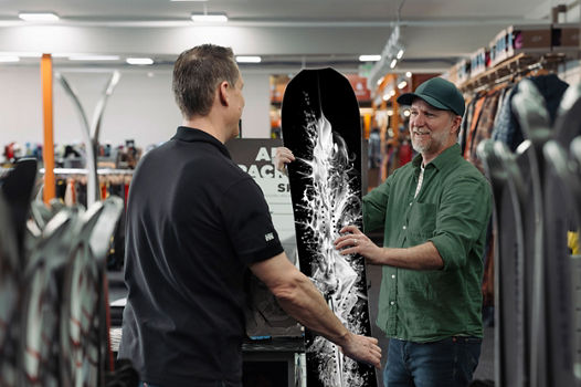 Epic Mountain Gear Employee Assisting Customer with Rentals at Boulder Location
