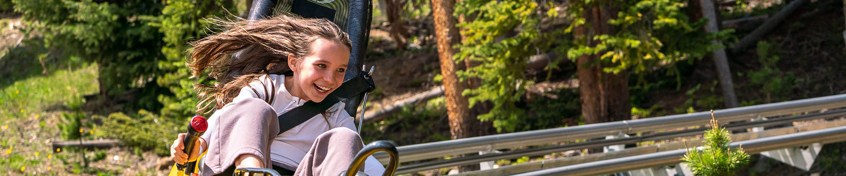 Girl Riding  Gold Runner Alpine Coaster at Breckenridge