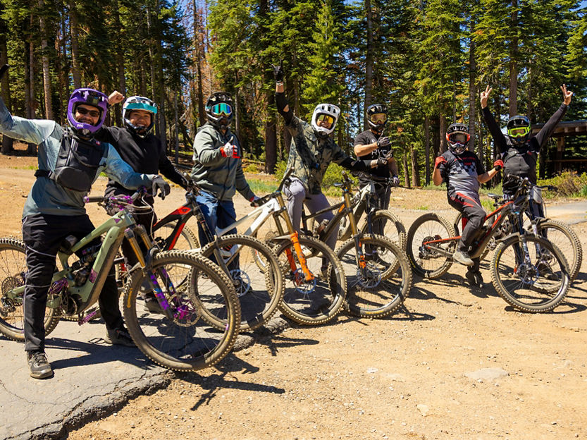 Group of bikers posing for a photo before riding
