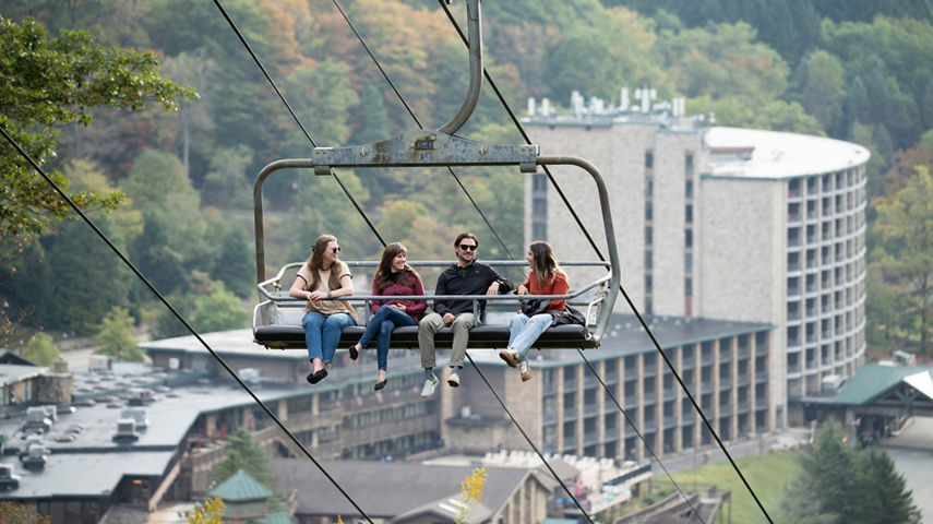 Group of Friends Taking Scenic Chairlift Ride at Seven Springs