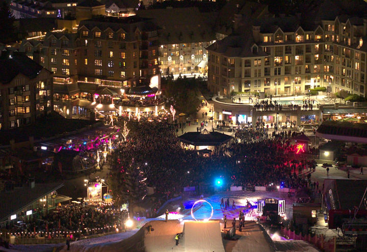 Nighttime Village Crowd Around Fire and Ice Event