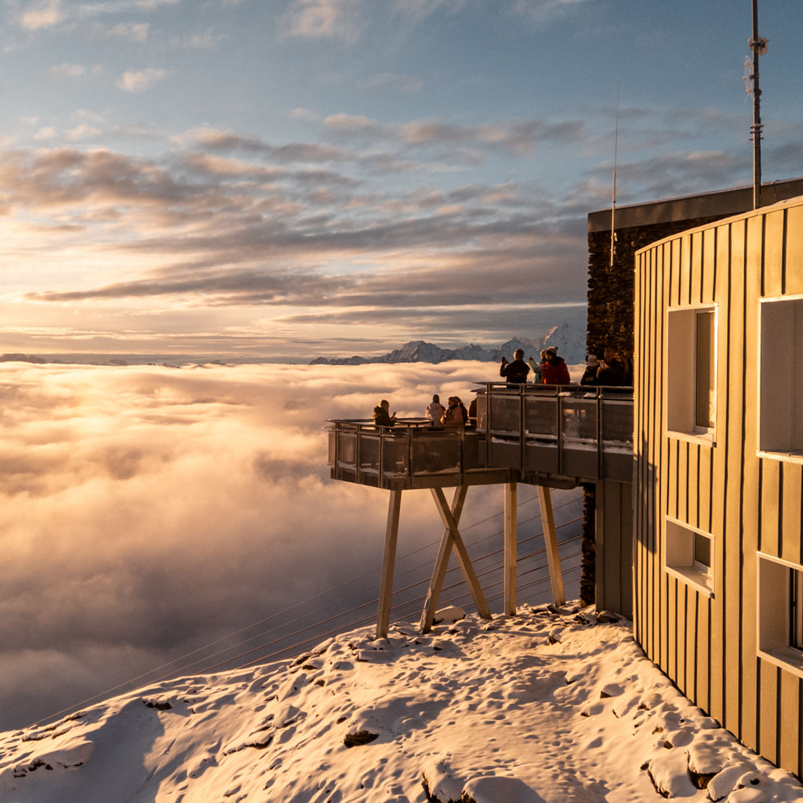 Guests Taking in Scenic View from Restaurant Deck at Skirama Dolomiti