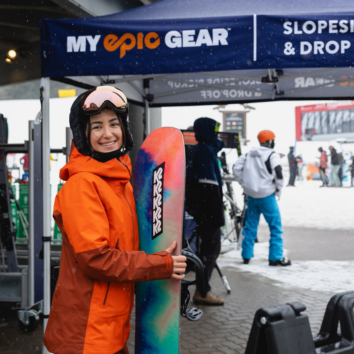 Woman Picking Up Gear at My Epic Gear Tent | Carousel