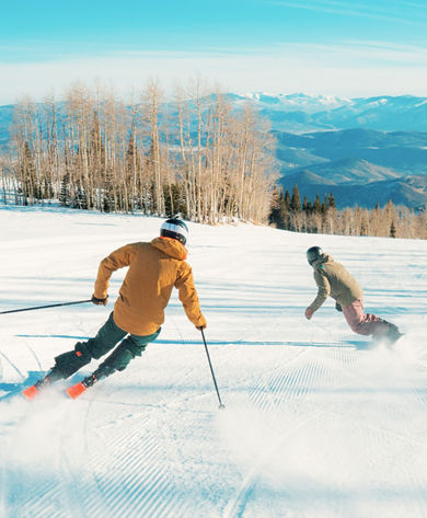 Guests Skiing and Snowboarding Down Freshly Groomed Bonanza Trail at Park City