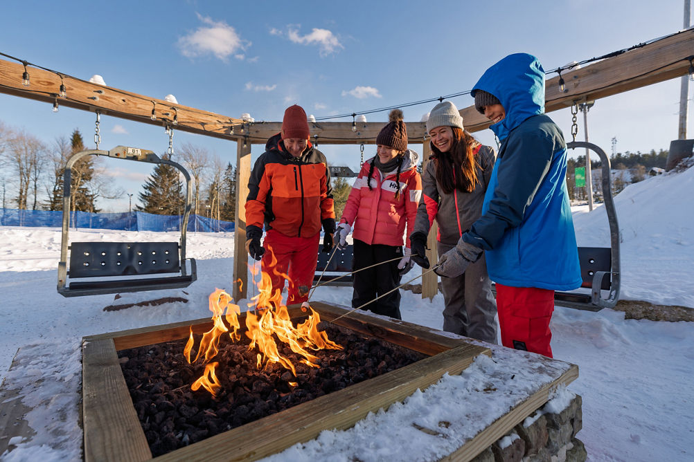 Family Roasting Marshmallows at Big Boulder's Base Area Firepit