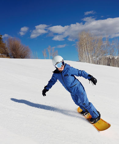 Youth Snowboarder Gliding Smooth Corduroy