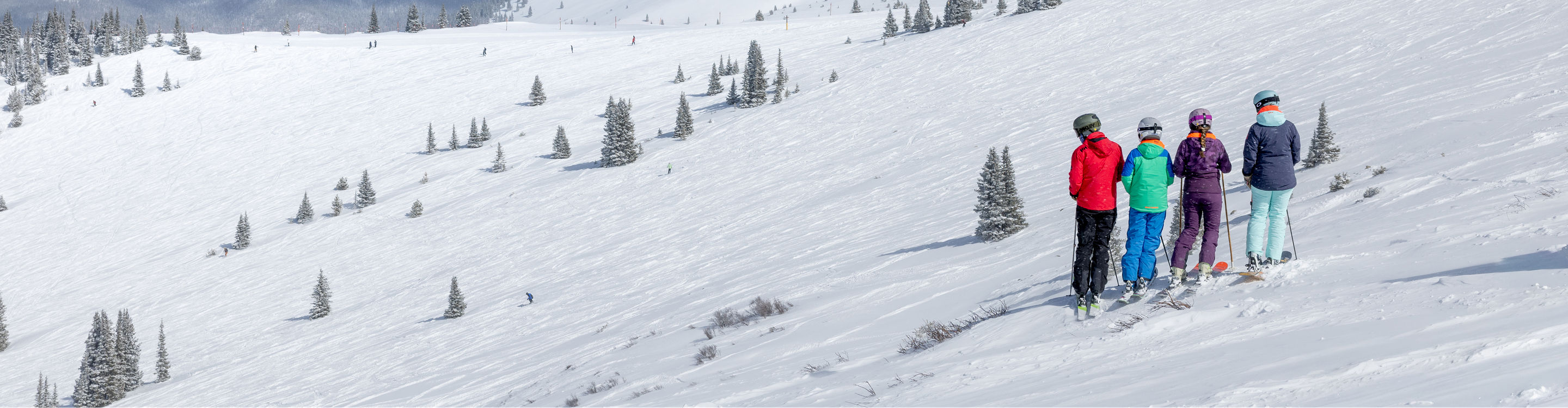 Family Taking a Break from Skiing to Take in Scenic Landscape at Keystone