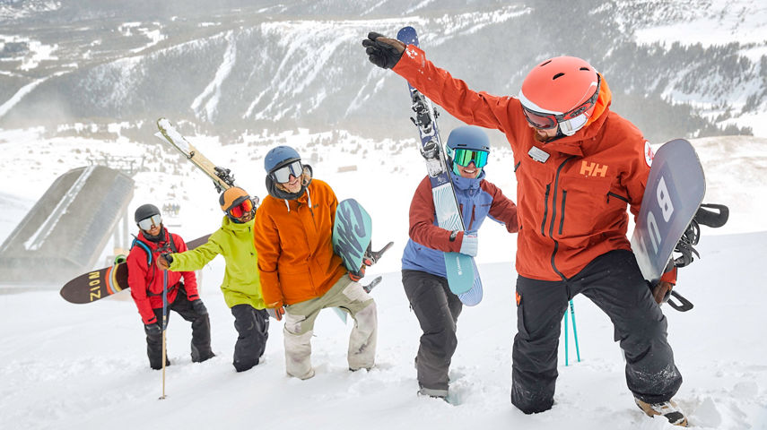 Friends skiing and snowboarding at Breckenridge, CO.