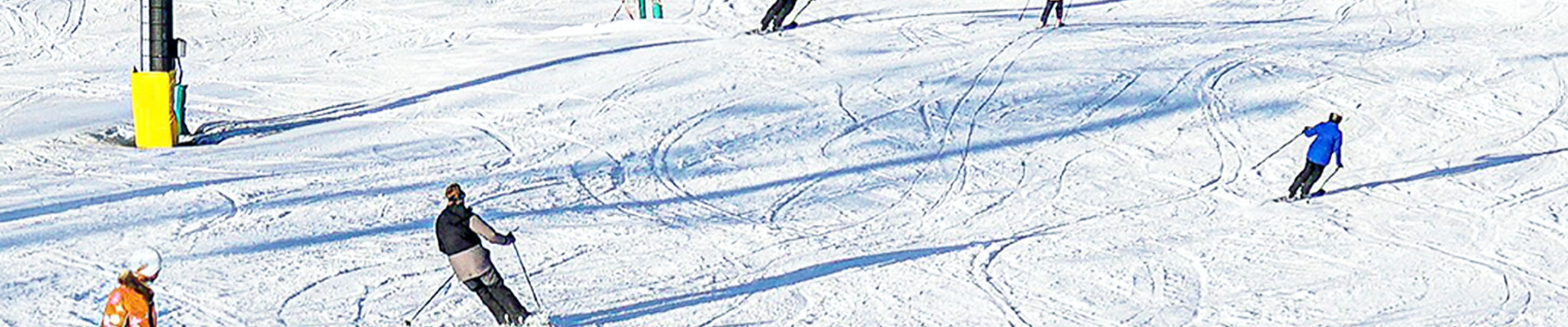 Group carving downhill at Hidden Valley