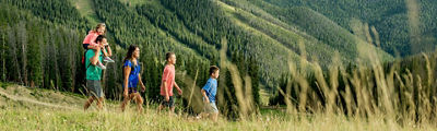 Family hiking in the summer at Keystone. 