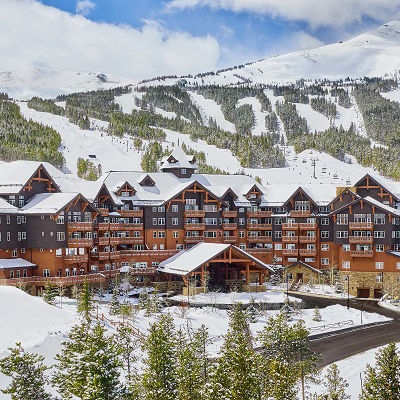 One Ski Hill Place with snowy mountain in background
