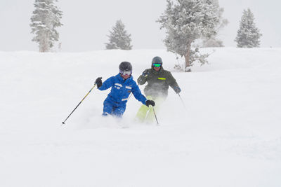 Ski instructor guides a skier in the backcountry in Vail, Colorado