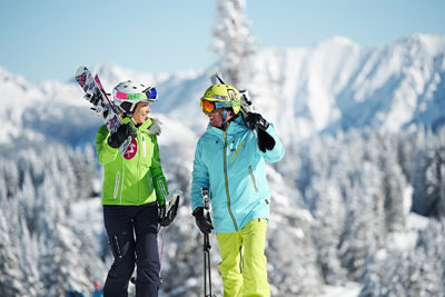 Skiers hike uphill during non lift operating hours at Vail Resort