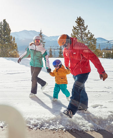 A family skis in for lunch at Pioneer Crossing in Breckenridge, CO.
