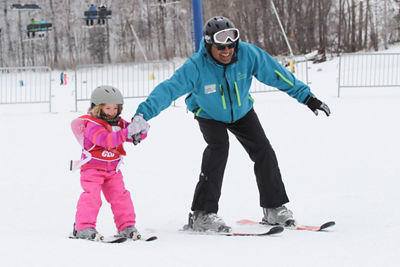 ski instructor and child 