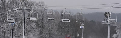 Snowy chairlift at Paoli Peaks
